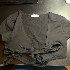 Black t shirt with ties in front. Never worn!